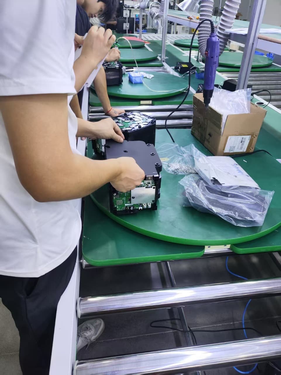 Assembly operators working on custom battery packs
